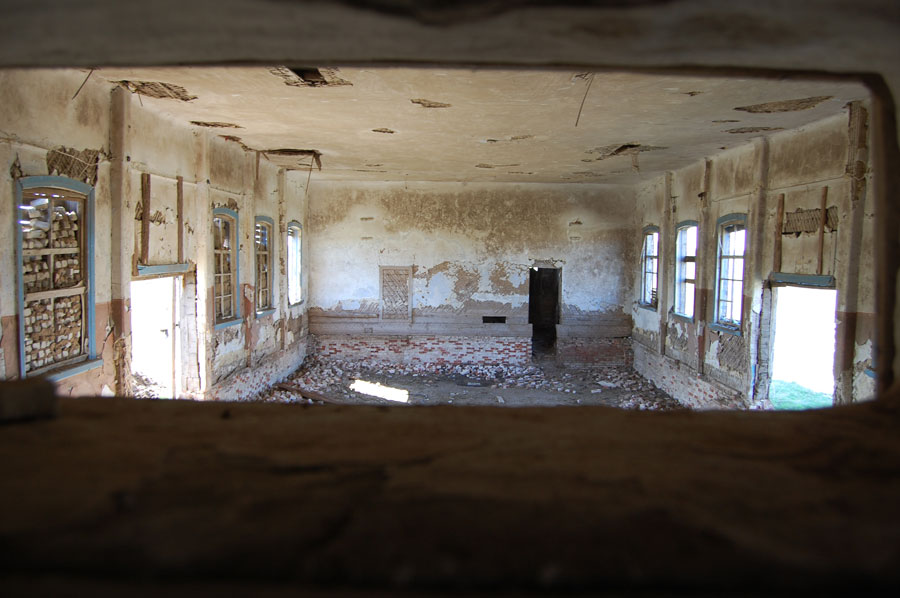 Interior of the Lutheran Church in Kratzke (2009). [taken through a projector slot; floor removed; foundation exposed] Source: Georgi Spach.
