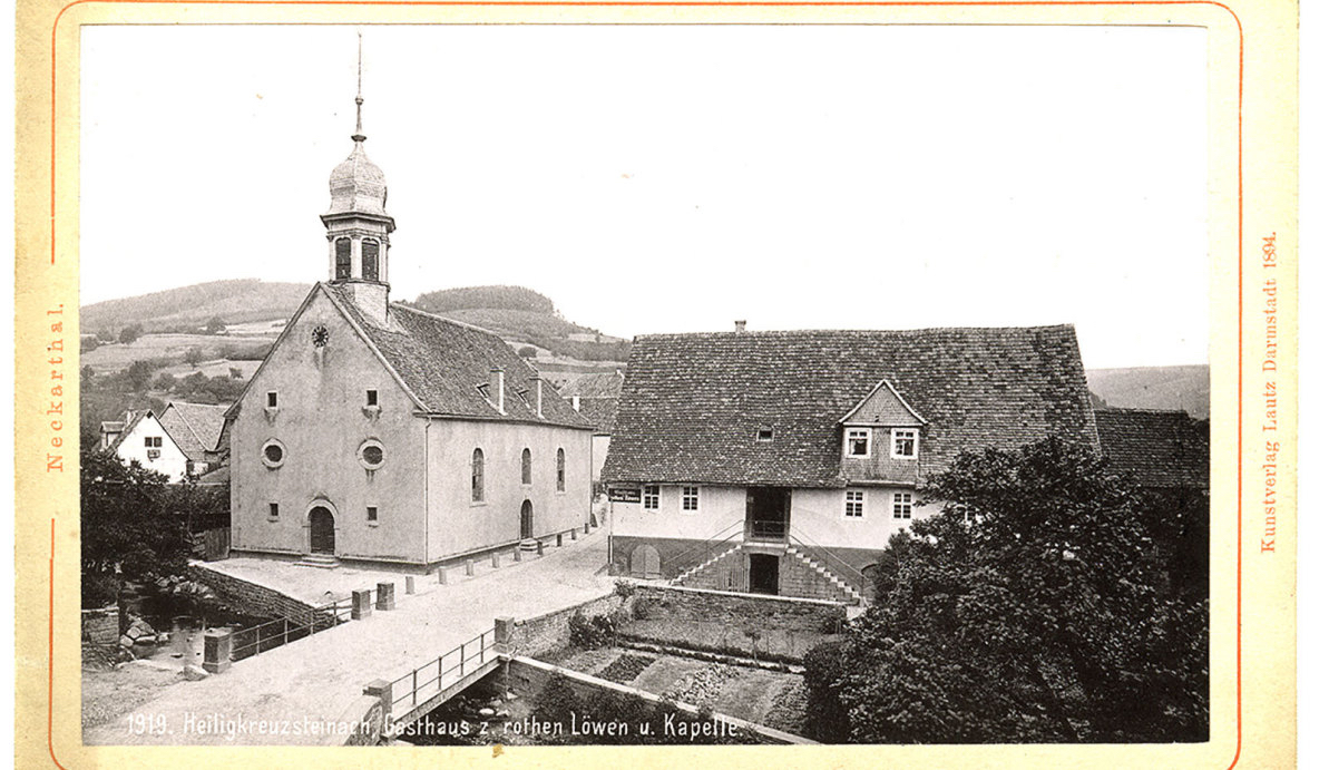 Postcard showing the former Reformed Church in Heiligkreuzsteinach in 1919. This church was built between 1744 and 1746. A large bell tower later replaced the original roof rider. Source: Gemeinde Heiligkreuzsteinach website: www.heiligkreuzsteinach.de