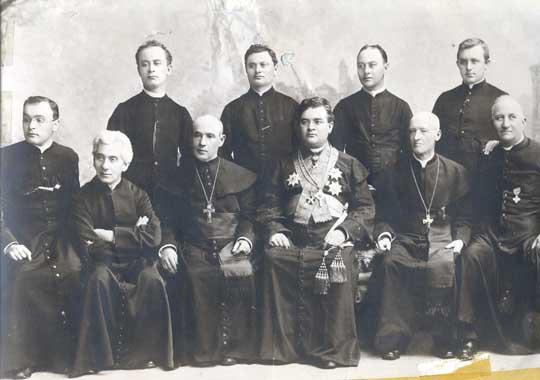 A group of Catholic priests serving the German-speaking populations of Russia.  Father Vondrau is seated, third from the left (wearing a cross).  Source: Germans from Russia Heritage Collection of North Dakota State University.