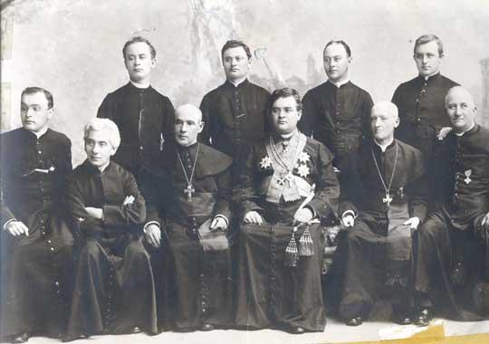 A group of Catholic priests serving the German-speaking populations of Russia.  Father Vondrau is seated, third from the left (wearing a cross).  Source: Germans from Russia Heritage Collection of North Dakota State University.