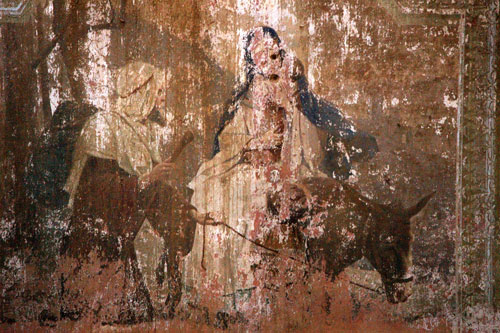 A fading mural of Joseph leading Mary and baby on a donkey inside the Marienberg Church. Source: Steve Schreiber.
