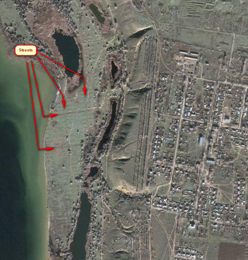 Satellite image showing the former (now partially flooded) location of Stahl am Tarlyk, along with the newer village on higher ground to the right. Source: Vladimir Kakorin.