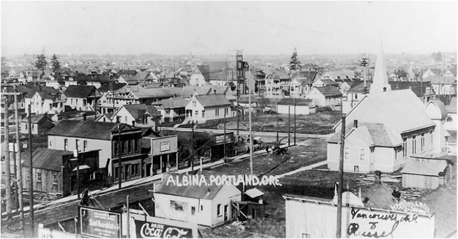The intersection of Vancouver Avenue and Russell Street in the Albina area of Portland, Oregon (1909). Source: Oregon Historical Society.